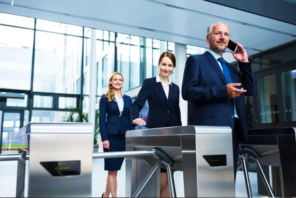 Business professionals at security turnstiles.